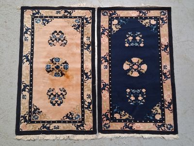 pair of oriental rugs on the floor
