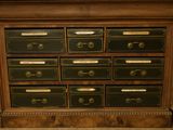 a large wooden dresser with many drawers on it