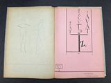 an open book with a drawing of a man and a cross on it