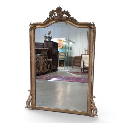 a mirror that is sitting on the floor in a room