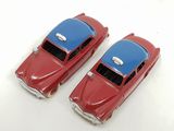 two red and blue toy cars sitting next to each other