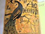 an open book with a picture of a peacock on it