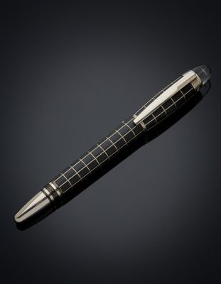 a pen with a black and white checkered pattern on it