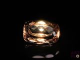 a close up of a ring with a light shining on it