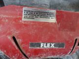 a close up of a red motorcycle with a sticker on it