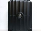 a black suitcase sitting on a white surface