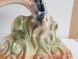 a figurine of a horse that is sitting on top of a table
