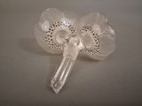a glass flower shaped object on a table