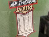 a close up of a green motorcycle with a sticker on it