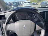 dashboard view of a car with a steering wheel and dashboard controls