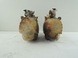 two figurines of animals sitting on top of each other