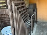 many chairs and buckets in the corner of a room
