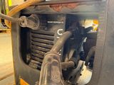a close up of a machine that has a hose attached to it