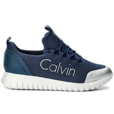 a close up of a blue and white sneakers with the word calvin written on the side