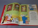 an open book with a picture of an elephant and a cat