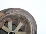 a close up of a helmet with a wheel on it