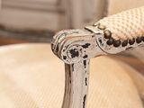 a close up of a white chair with a black and white design