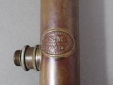 a close up of a baseball bat with a number on it