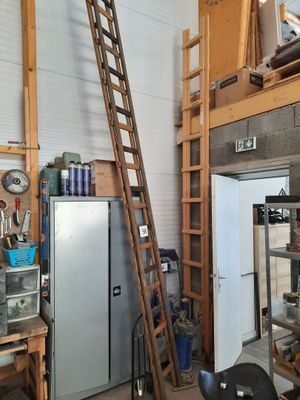 a ladder leaning up against a wall in a garage