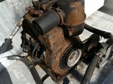 a small engine that is sitting in the back of a truck