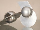 a metal object that is sitting on a glass table