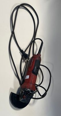 a red electric drill with a cord attached to it