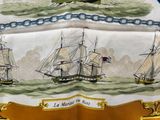 a picture of a sailboat on a table cloth