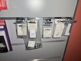 a refrigerator with a bunch of tags hanging on it