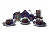 a group of cups and saucers sitting on a table
