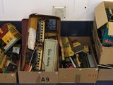 many boxes of toy trains sitting on the floor