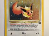 a close up of a pokemon card on a white surface