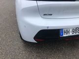 a white car parked on the side of the road