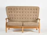 an image of a brown couch sitting on top of a white floor