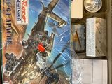 a box with a toy airplane in it on a table