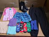 many pairs of socks, socks, socks, and socks on a table