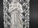 an image of a clear glass bottle with a jesus on it
