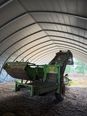 a tractor that is parked inside of a building