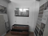an image of a room with a lot of pictures on the wall