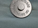 a coin sitting on top of a piece of cloth
