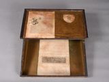 an open box that has a book inside of it