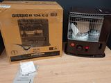 a box with a bird in it next to a heater on a table