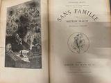 an old book with a picture of a family in it