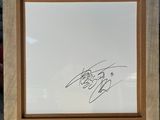 an easel with a drawing of a man holding a baseball bat