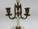 an image of a candle holder with three candles on it