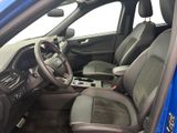 the interior of a blue car with black leather seats and a steering wheel