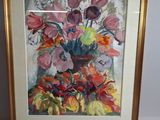 tableau représentant un vase de fleurs dans un cadre doré, accroché à un mur blanc
