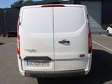 a white van that is parked in a parking lot