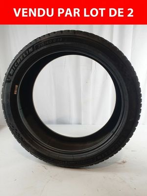 an image of a tire on a white surface with a red background