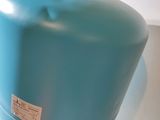 a blue tank sitting on top of a white counter