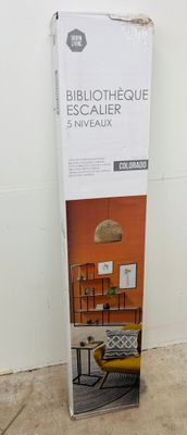 the box is open to show the contents of the furniture